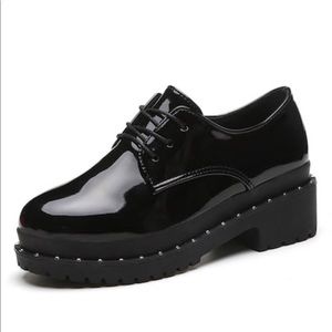 Studded patent leather oxfords